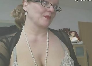 Busty MILF is touching her nice tits